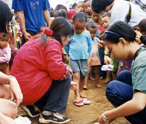 Giving Shoes to poor children